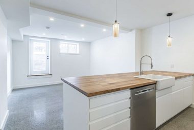 Basement underpinning and renovation with open concept living area in Junction Triangle by Ashford Homes