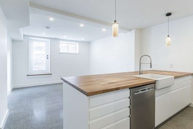 Basement underpinning and renovation with open concept living area in Junction Triangle by Ashford Homes